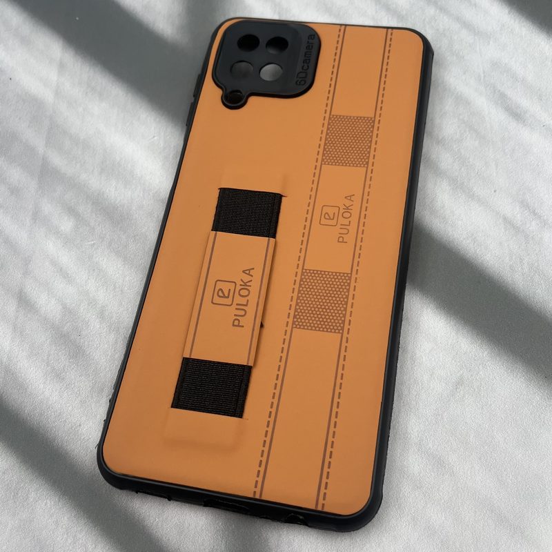قاب گوشی Galaxy A12 / Galaxy M12 سامسونگ فینگر بند ایربگ دار چرم Puloka چرم عسلی محافظ لنز دار کد 54331 - Image 2