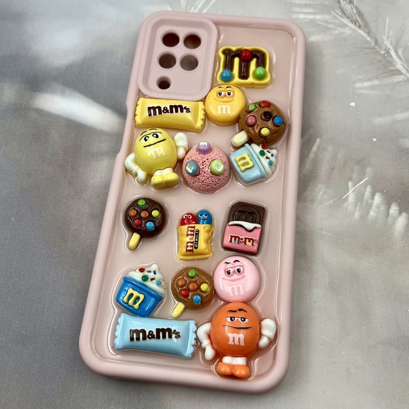 قاب گوشی Galaxy A12 / Galaxy M12 سامسونگ Solid Case سیلیکونی ضد ضربه طرح استیکر M&M محافظ لنز دار صورتی کد 50736 - Image 2